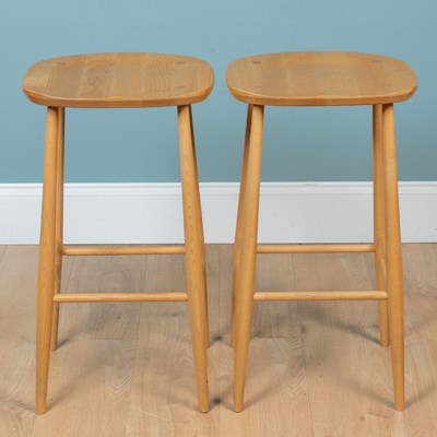 Lot 173 - A pair of Ercol elm bar stools