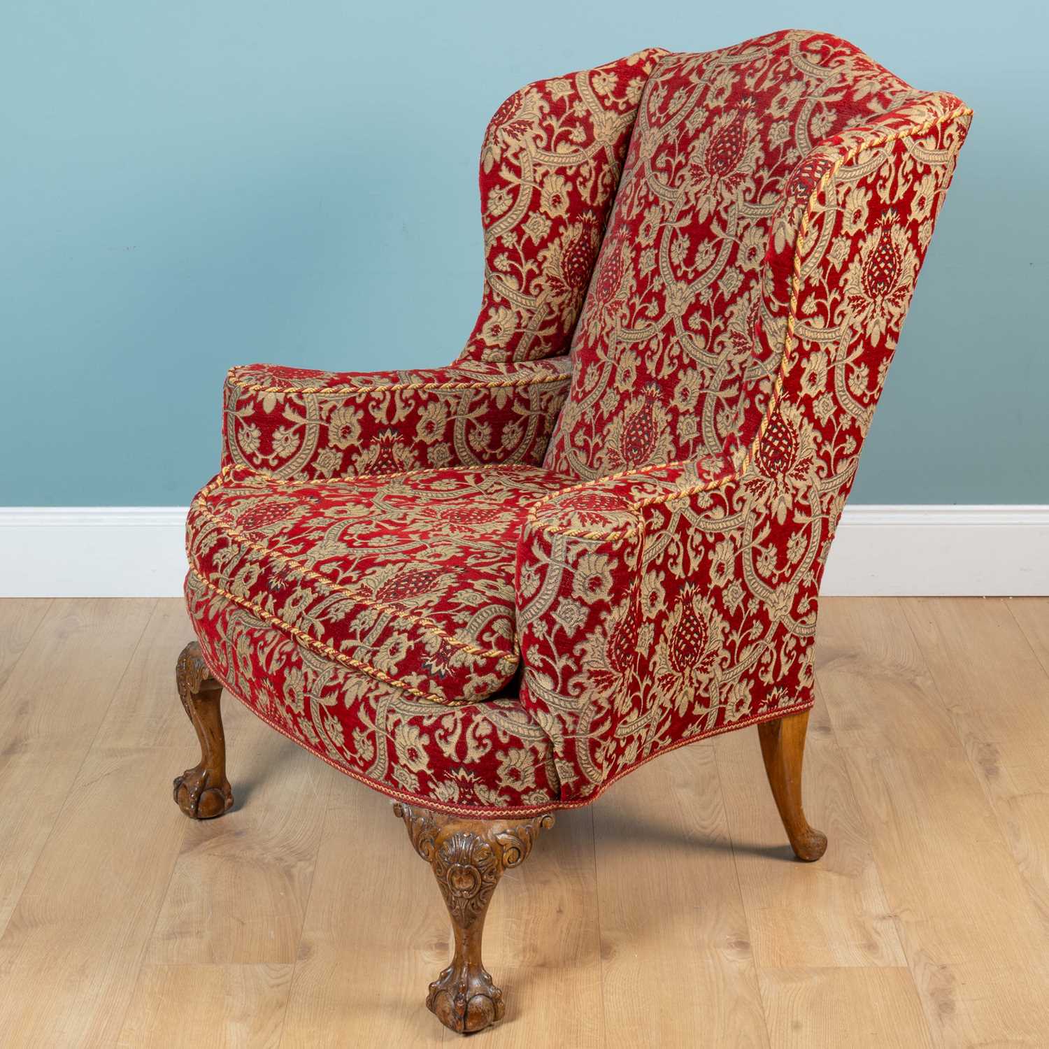 Lot 39 - A Georgian style wingback armchair