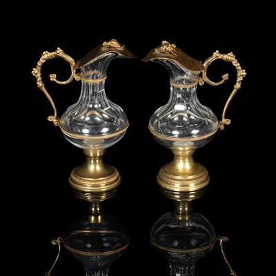 Lot 267 - A pair of 19th century cut glass and gilt metal mounted ecclesiastical church wine ewers