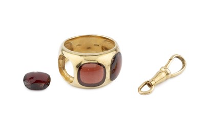 Lot 382 - A stone set dress ring, set with brownish-red...