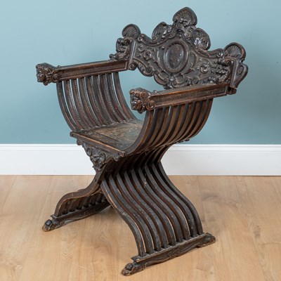 Lot 435 - An antique Italian dark stained walnut Savanorola chair