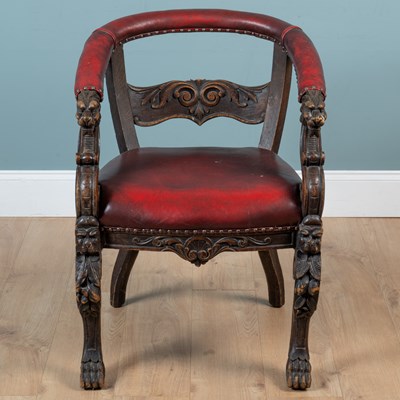 Lot 318 - An antique horse shoe backed desk chair