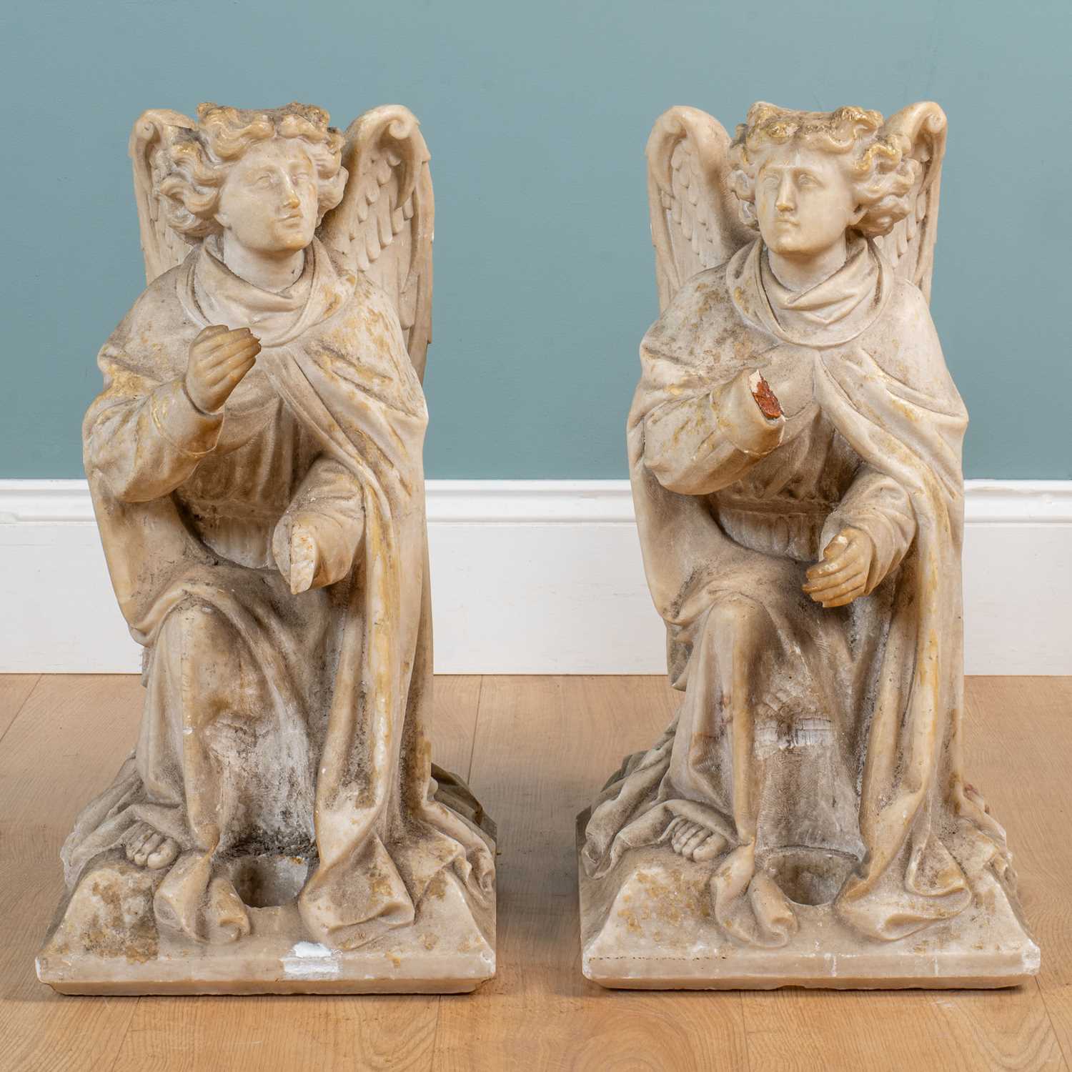 Lot 1064 - A pair of 19th alabaster sculptures of kneeling angels