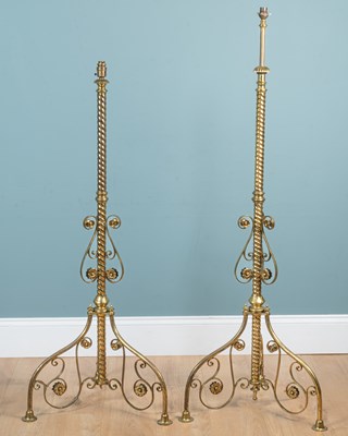 Lot 369 - A pair of Victorian Gothic-style brass lamp standards