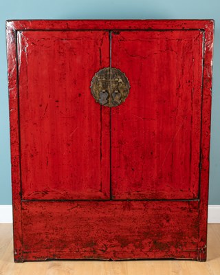 Lot 208 - A red-lacquered elm cupboard