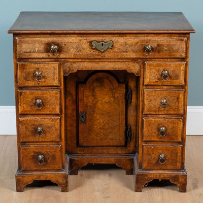 Lot 10 - A Queen Anne walnut kneehole desk