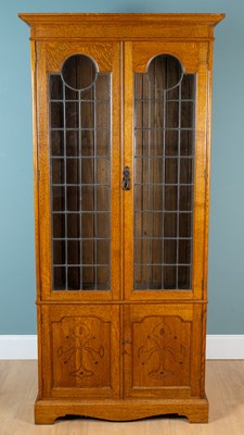 Lot 445 - An Arts & Crafts oak bookcase