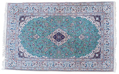 Lot 490 - A hand woven Isfahan style carpet