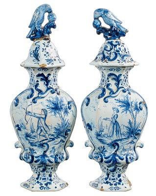 Lot 243 - A pair of 18th/19th century Dutch Delft lidded vases