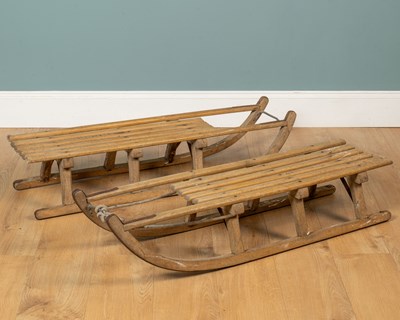 Lot 1311 - Two vintage wooden sledges