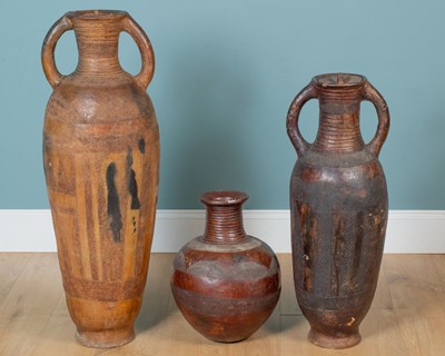 Lot 132 - A collection of three African clay pots