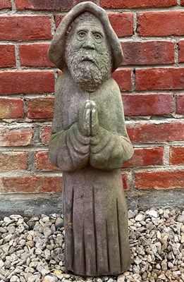 Lot 1058 - An old weathered sculpture of a praying monk