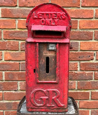 Lot 1026 - An original old red-painted cat iron letterbox