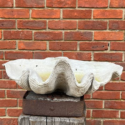 Lot 1079 - A cast reconstituted stone "giant clam shell"