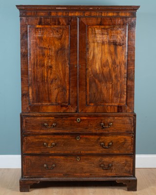 Lot 374 - An early 19th century mahogany linen press
