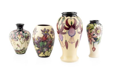 Lot 552 - Moorcroft Pottery Four Vases of various floral...