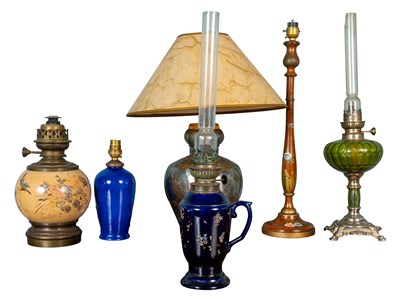 Lot 381 - A collection of six table and oil lamps