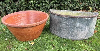 Lot 1091 - A terracotta bread crock and a galvanised water cistern