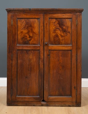 Lot 473 - An antique oak wall cupboard the pair of panel...