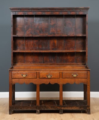 Lot 469 - An 18th century oak dresser with a three tier...