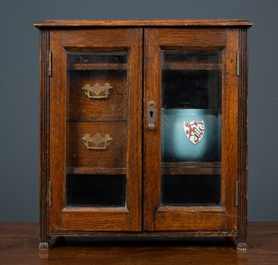 Lot 79 - A late 19th / early 20th century oak tobacco...