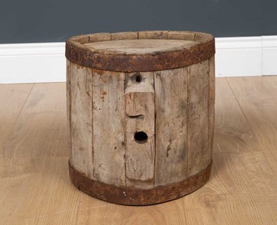 Lot 424 - A wooden cast iron bound costrel 26cm diameter...