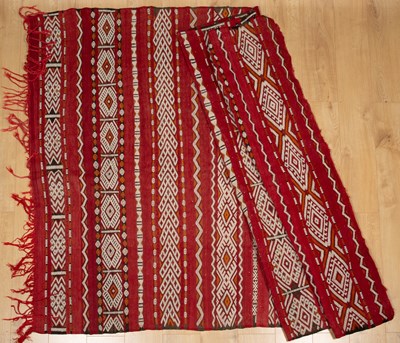 Lot 432 - A red kelim with white, orange and brown...