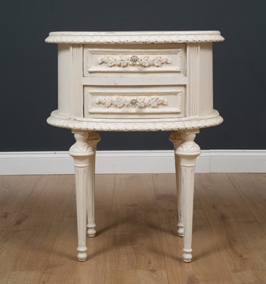 Lot 524 - A white painted oval wooden table with...