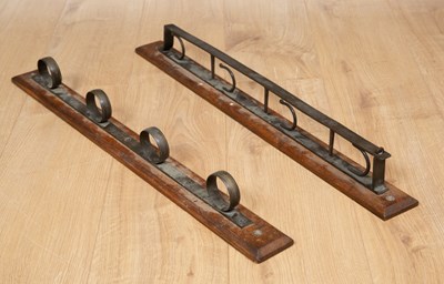 Lot 436 - A four gun mounted wall rack, the brass...