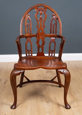 Lot 590 - A Gothic style hardwood Windsor armchair, with...