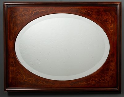 Lot 453 - An oval bevelled edge wall mirror within an...
