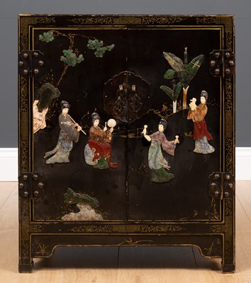 Lot 618 - A black lacquered Chinese cabinet decorated...