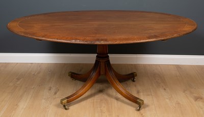 Lot 626 - A large mahogany oval tilt top table with...