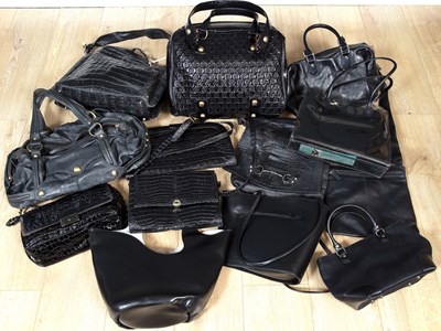 Lot 181 - A collection of mostly black leather handbags...