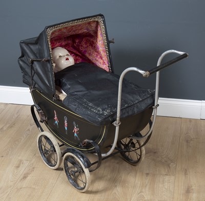 Lot 110 - A Vintage doll's metal pram with a WPS folding...