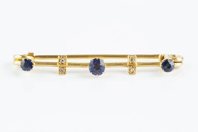 Lot 140 - A sapphire and diamond set bar brooch, the...