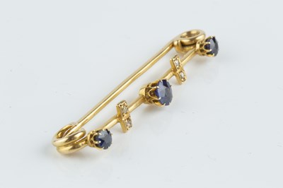 Lot 140 - A sapphire and diamond set bar brooch, the...
