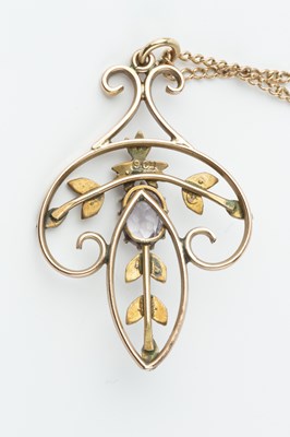 Lot 72 - An Edwardian amethyst and half pearl pendant,...