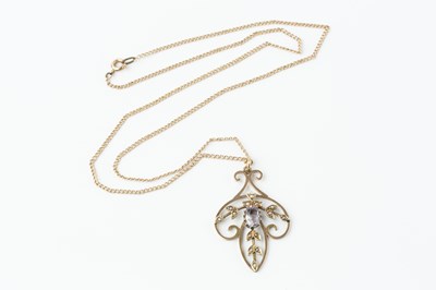 Lot 72 - An Edwardian amethyst and half pearl pendant,...