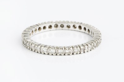 Lot 154 - A diamond full hoop eternity ring, set...