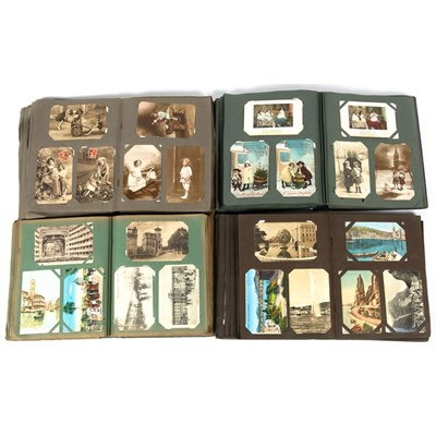 Lot 202 - Four early 20th century postcard albums with...