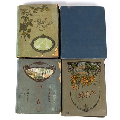 Lot 202 - Four early 20th century postcard albums with...