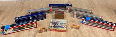 Lot 93 - A collection of boxed toy trains to include...