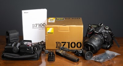 Lot 19 - A Nikon D7100 Camera Outfit to include MB-D15...