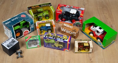 Lot 95 - A collection of boxes toy tractors comprising...