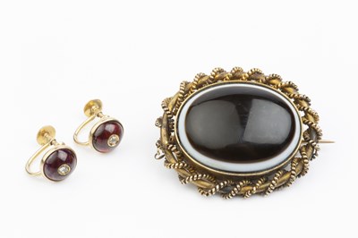 Lot 19 - A Victorian banded agate memorial brooch, the...