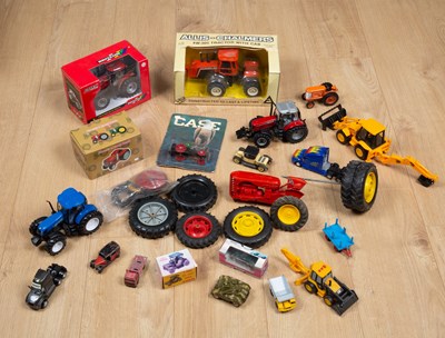 Lot 106 - A collection of toy tractors to include an...