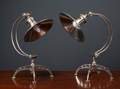 Lot 484 - A pair of contemporary white metal adjustable...