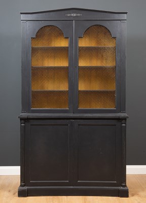 Lot 224 - A black painted library cabinet the upper...