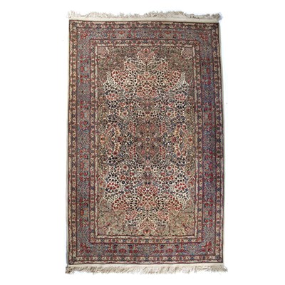 Lot 6 - Cream ground rug with foliate designs within a...